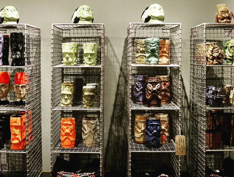 Tiki mugs on display at an exhibition